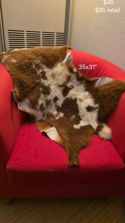 Small natural animal hide throw rug/accent piece