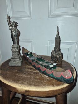 Vintage metal canoe decor, empire state building bank and statue of liberty