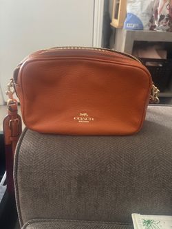 Woman’s Coach Brand crossbody bag and wallet