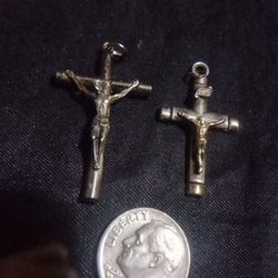 2 Sterling Silver Crosses.