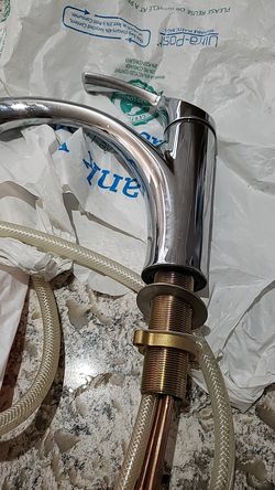 KOHLER kitchen faucet in Chrome with sprayer.