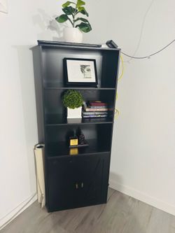 Black wood bookcase with cabinet