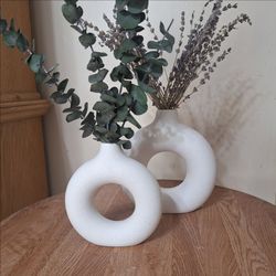 Set of 2 white ceramic speckled donut vases