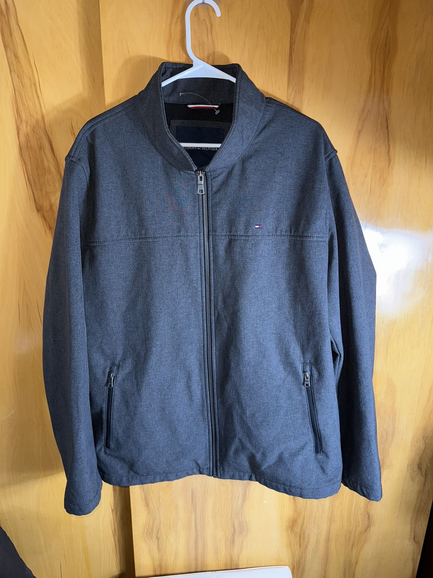 This is a gray Tommy Hilfiger full-zip jacket For Men -unused 