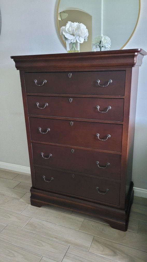Tall Wood Dresser. Used in very good condition. 

39"W x 20"D x 55.5"H 

Decor Not Included 

$195