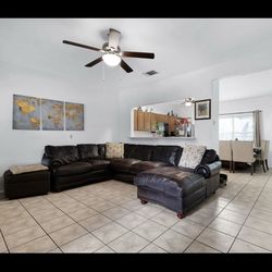 Dark brown leather sectional couch