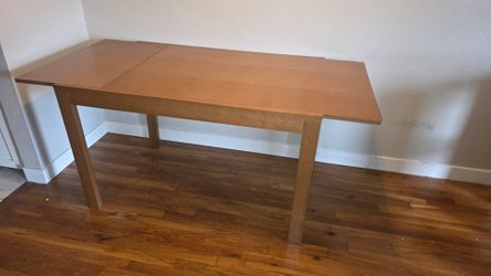 Table with build in leaf