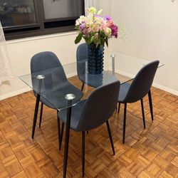 Full glass dining table with 4 chairs (measurements in pictures)