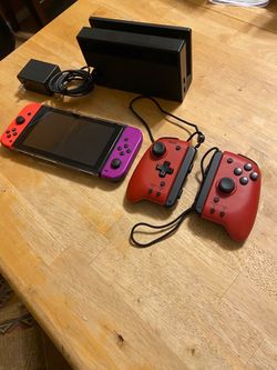 Nintendo Switch with Dock, Charger, 128 gig micro SD card, and extra controllers