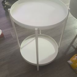 a two-tier round side table