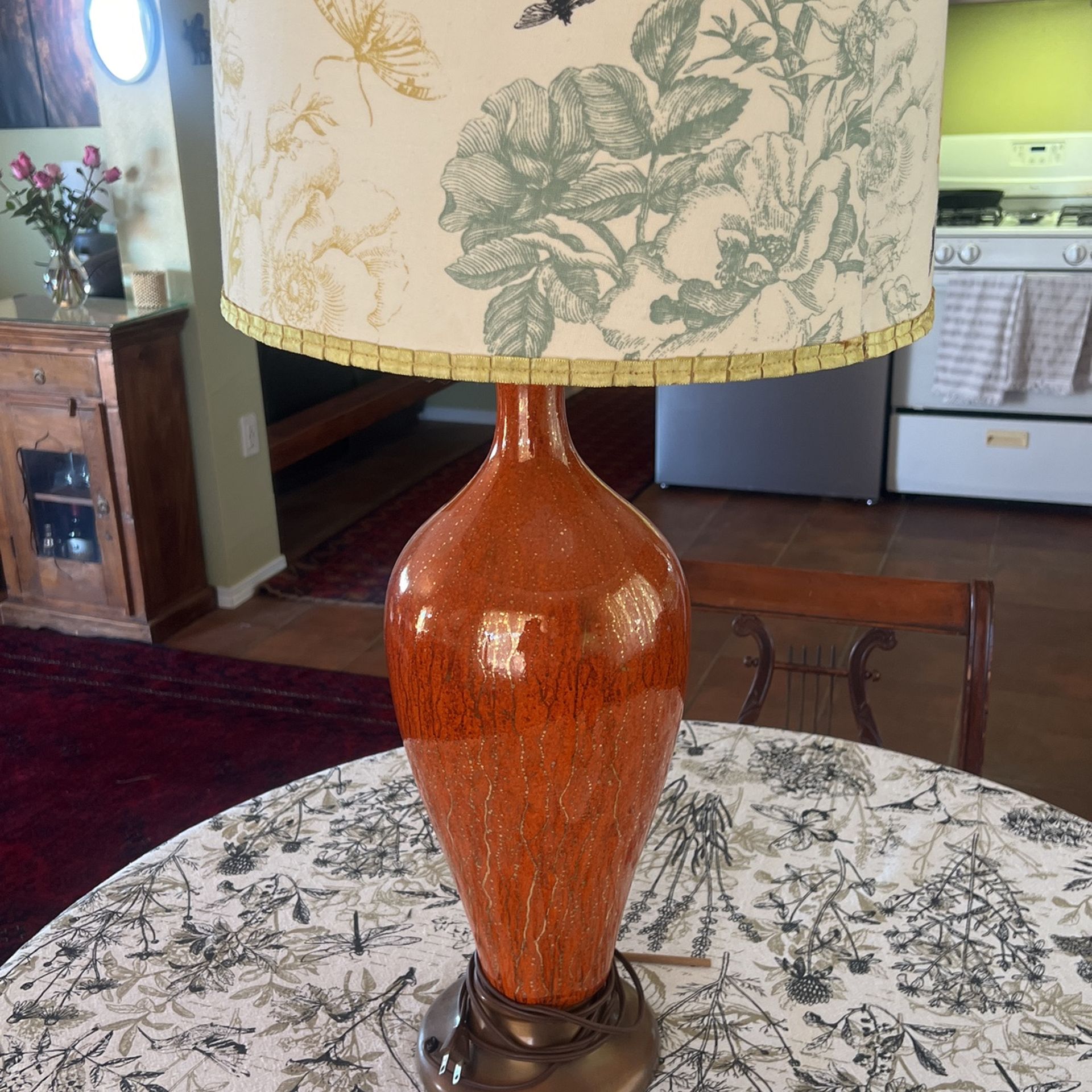 Antique lamp with custom shade.