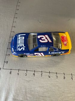 1997 Action Racing Collectables 1/24 scale diecast car featuring the #31 Lowe's Chevrolet Monte Carlo driven by Mike Skinner.