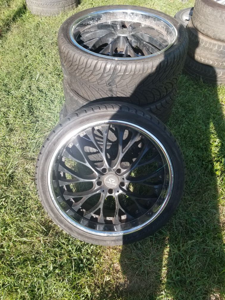 22 inch black rims with new tires 19 inch rims with slightly used tires