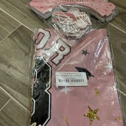 Pink Graduation Table Cover With 24 Cupcake Wrappers And Toppers 