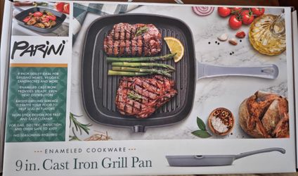 9 in cast iron pan. Brand new. Unopened