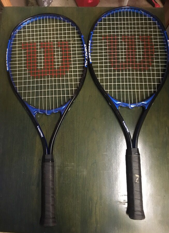 2 Wilson energy xl tennis rackets.