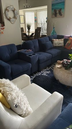 Navy blue sectional not even a year old with ottoman. No stains? No scratches