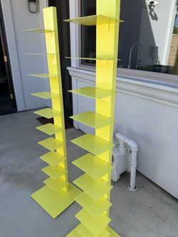 CB2 bright yellow book towers