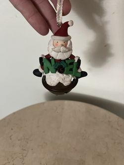 Christmas Santa Holding Word NOEL Porcelain Ornament
