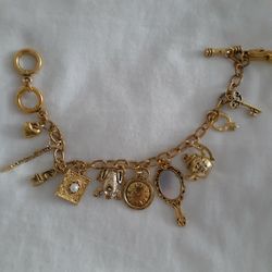 GOLD TONE CHARM BRACELET 