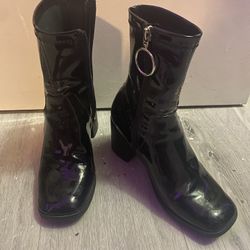 Black patent leather heeled boots with silver hoop accent (SIZE 6 US)