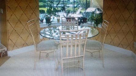 4 chairs and a glass table