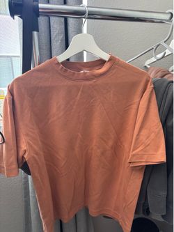 Orange Uniqlo airism shirt