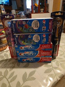 Kids Crest toothpaste and 1 boy power toothbrush and 1 girl power toothbrush