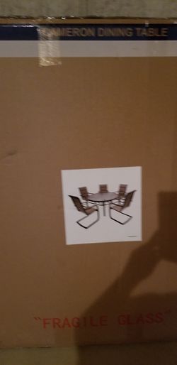 New in box 5 chairs and round patio glass table moving dont need