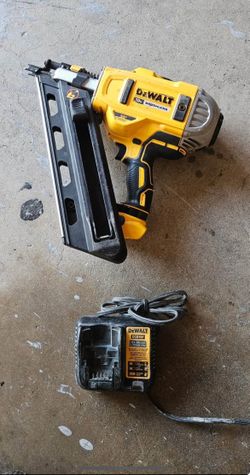 DEWALT 20V MAX XR Brushless Cordless Framing Nailer and a DEWALT DCB107 charge