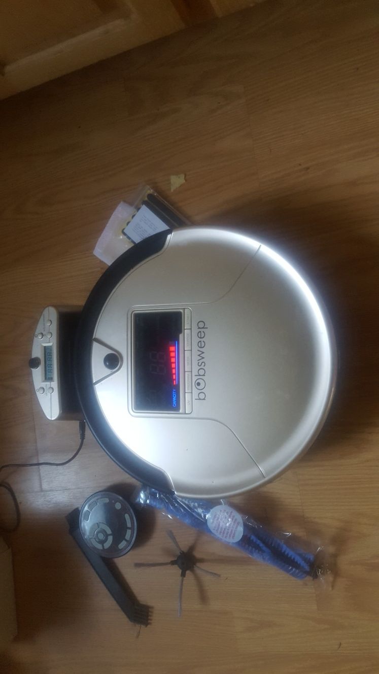 Bob sweep robotic vacuum hardly used. Like new! With all parts