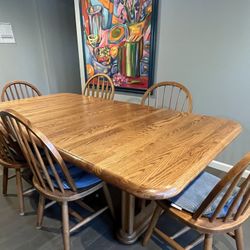 Expandable solid oak dining table 