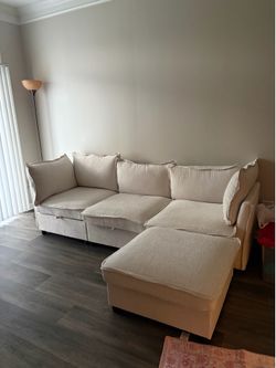 Cream sectional sofa w/ storage ottoman and chaise—excellent condition