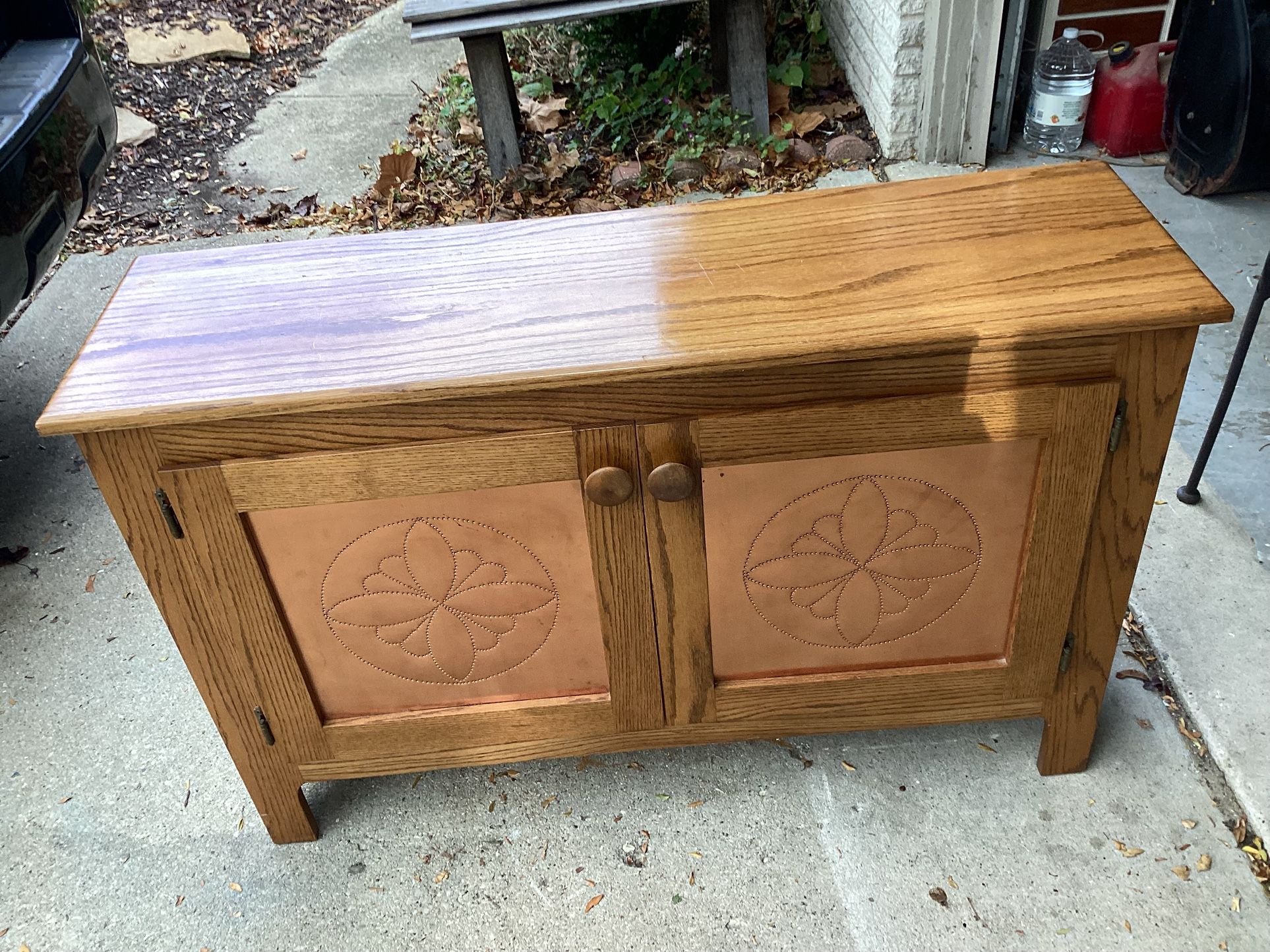 Amish wood cabinet 2 doors open to adjustable shelf very clean beautiful doors have copper inserts 45 Long - 15 Deep- 29 Tall must see