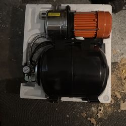 Shallow wall pump with tank