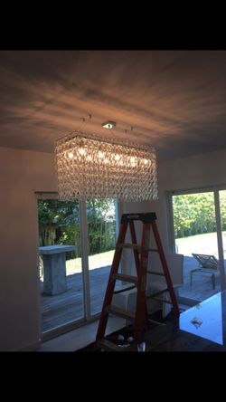 New in box . Never used. Cristal chandelier .