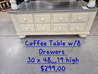 Coffee Table w 8 drawers We are located at 2811 East Bell road. Another Time Around Furniture.