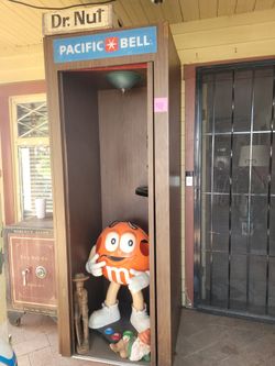 Old Phone Booth With A Phone