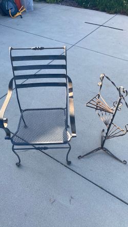Old metal chair and plant stand