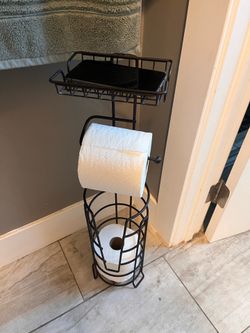 Toilet paper holder with cell phone shelf
