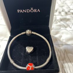 Pandora bracelet and  2 charms 