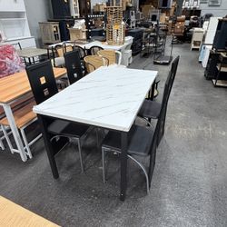 (51x30)’’ Dining tabl e with 4 black ch air