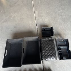 Tesla Model Y center console organizer trays and underwear storage bins