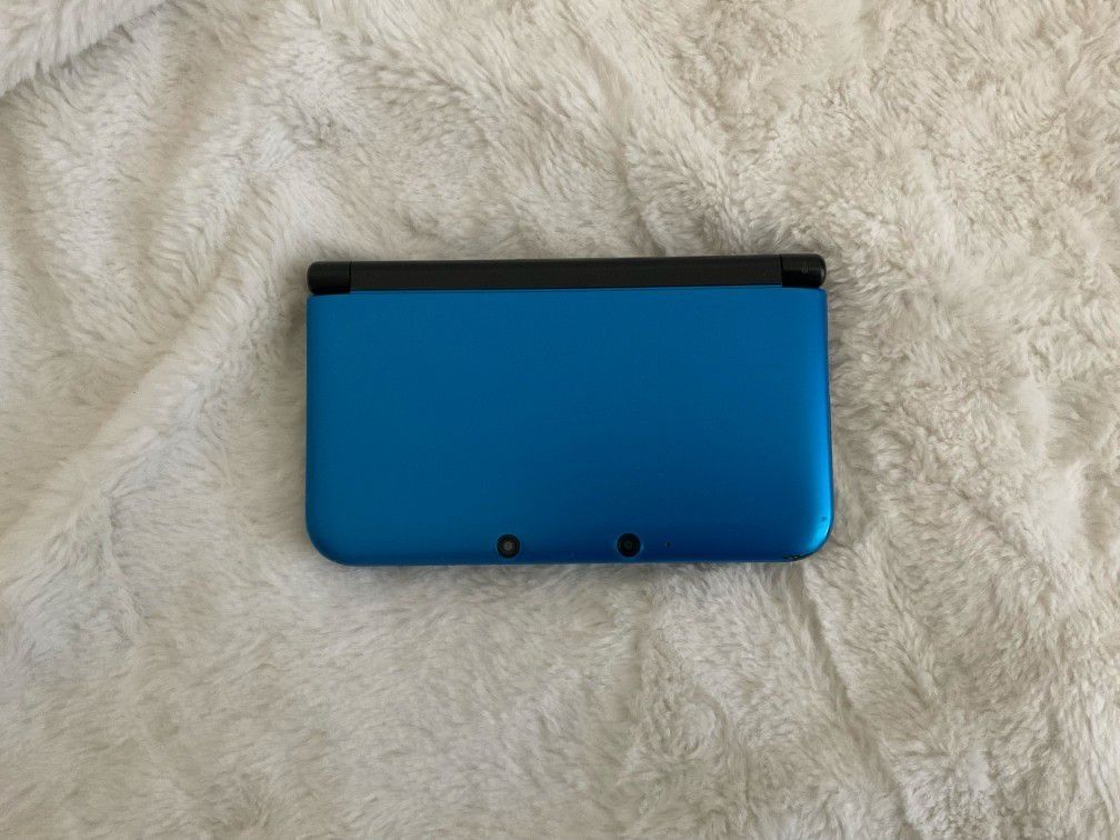 blue Nintendo 3ds XL with original charger and memory card