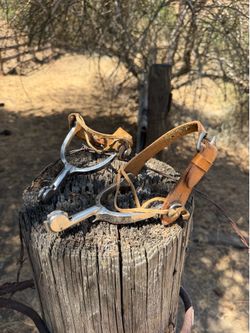 Antique spurs bull rider cowboy