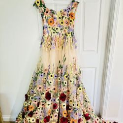 Stunning floor-length champagne tulle ball gown with vibrant multicolored 3D floral embroidery and appliqués. 