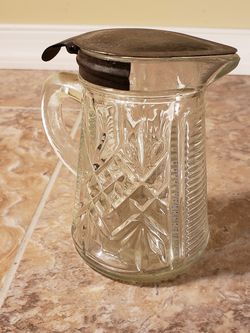 This old molasses or syrup has a tin lid