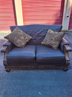 Dark Brown Leather Loveseat with Carved Wood Frame