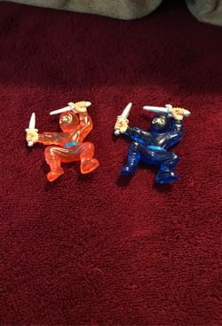 Two 1 inch plastic ninjas