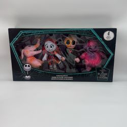 Disney Tim Burton's The Nightmare Before Christmas Plush Collector Set, featuring stylized neon-colored plushies of Jack Skellington, Sally, Zero, and
